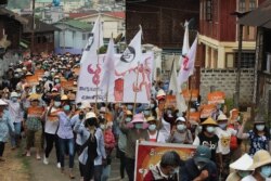 Protesters take part in a demonstration against the military coup in Mogok town, north of Mandalay, in this photo taken and received courtesy of an anonymous source via Facebook on April 9, 2021.