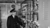 FILE - Coast Guard Ensign Henry H. Lodge, seen March 2, 1952, looks over big glass tubes of a high voltage rectifier unit aboard the Coast Guard Cutter Courier.