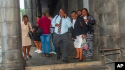 Chagossians, led by Olivier Bancoult, center, are shown outside the Mauritian prime minister's office in Port Louis, Mauritius, Oct. 3, 2024, after learning that the U.K. had agreed to hand sovereignty of the Chagos Islands to Mauritius.