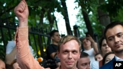 FILE - Prominent Russian investigative journalist Ivan Golunov, greets colleagues and his supporters as he leaves a Investigative Committee building in Moscow, Russia, June 11, 2019.