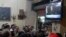 Anti-President Mohamed Morsi protesters watch a speech by him on TV at a cafe in Tahrir Square in Cairo, July 2, 2013.