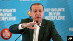 Turkey's President Recep Tayyip Erdogan gestures as he delivers a speech at his ruling political party's conference in Afyonkarahisar province in western Turkey, Oct. 7, 2017. Erdogan has announced the country is conducting a "serious" operation against extremist groups in Syria's northwestern Idlib province with Turkey-backed rebels.