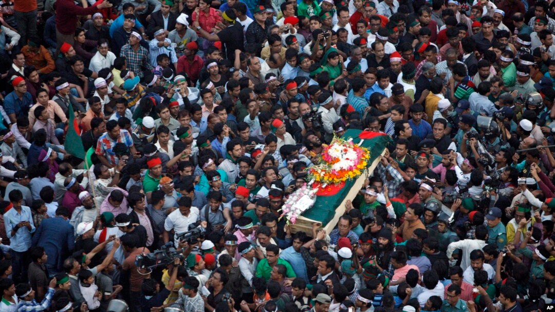 FILE - Bangladeshi mourners carry the coffin containing the body of blogger Ahmed Rajib Haider for funeral in Dhaka, Bangladesh, Feb. 16, 2013.