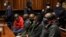 Some of the eight suspects in the VBS Mutual Bank fraud case appear at the Palm Ridge Regional Court in Alberton, South Africa, June 18, 2020.