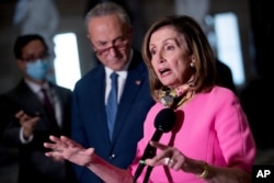 House Speaker Nancy Pelosi, accompanied by Senate Minority Leader Sen. Chuck Schumer, speak to reporters following a meeting with Treasury Secretary Steven Mnuchin and White House Chief of Staff Mark Meadows, on Capitol Hill, Aug. 7, 2020.