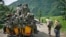 FILE - M23 rebels withdraw from the Masisi and Sake areas in eastern Congo, Nov 30, 2012.