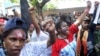 Papuan activists shout slogans at a rally commemorating the 57th anniversary of the failed efforts by Papuan tribal chiefs to declare independence from Dutch colonial rule, in Surabaya, Indonesia, Saturday, Dec. 1, 2018.