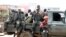FILE - Congolese soldiers are seen on a pick-up truck after dispersing civilians protesting against what they say is the government's failure to stop killings and inter-ethnic tensions in the town of Butembo, North Kivu province, DRC, Aug. 24, 2016.