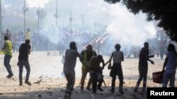 Flares are fired as members of the Muslim Brotherhood and supporters of ousted Egyptian President Mohamed Morsi clash with anti-Morsi protesters, along Qasr Al Nil bridge in Cairo, July 22, 2013. 