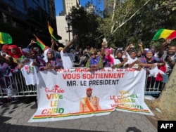 FILE - Guinean demonstrators show their support for leader Guinean leader Colonel Mamady Doumbouya, who took power in a coup in 2021, outside United Nations headquarters in New York during the 78th UN General Assembly in New York on Sptember 21, 2023.