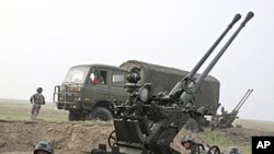 Chinese soldiers take part in the Vanguard 2010 live-fire air defense exercise in central China's Henan province (2010 file photo)