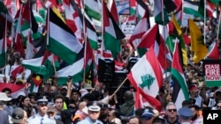 People march on the street as Pro-Palestinian supporters rally in Sydney, Oct. 6, 2024.