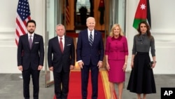 FILE - President Joe Biden, third left, and first lady Jill Biden, second right, greet Jordan's King Abdullah II, second left, Queen Rania, right, and Crown Prince Hussein, left, on the North Portico of the White House, February 12, 2024, in Washington.