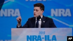 FILE - Kyle Kashuv, survivor of the Stoneman Douglas High School shooting, speaks at the National Rifle Association Institute for Legislative Action Leadership Forum in Lucas Oil Stadium in Indianapolis, April 26, 2019.