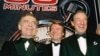 In this Nov. 10, 1993 file photo, The "60 Minutes" team, from left, Morley Safer, Steve Kroft and Mike Wallace pose at the Metropolitan Museum of Art in New York.