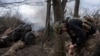 A Ukrainian serviceman of the Khartia brigade fires an M101 Howitzer toward Russian positions in Ukraine's Kharkiv region, March 12, 2025.