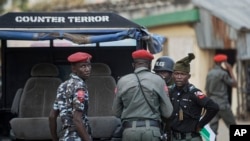 FILE—Counter-terror and regular police provide security at the offices of the Independent National Electoral Commission in Kano, northern Nigeria February 14, 2019. 