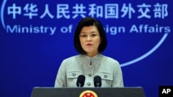 Chinese foreign ministry spokeswoman Jiang Yu responds to questions during a press briefing in Beijing where China reiterated its opposition to the use of force in Libya amid Western air strikes there and called for an immediate ceasefire in the country's
