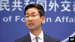 FILE - In a still image from video, Chinese Foreign Ministry spokesman Geng Shuang speaks during a media briefing in which he commented on investigations into Chinese-Australian writer Yang Hengjun in Beijing, July 17, 2019.
