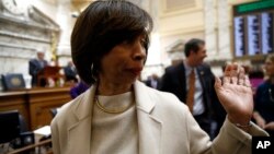 Baltimore Mayor Catherine Pugh walks on the Maryland House of Delegates chamber floor before Gov. Larry Hogan's annual State of the State address to a joint session of the legislature in Annapolis, Md., Wednesday, Jan. 30, 2019. 