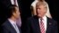 FILE - Donald Trump Jr. talks with his father, then-Republican presidential candidate Donald Trump, during the 2016 Republican National Convention in Cleveland, Ohio, July 20, 2016.