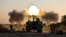 Une unité d'artillerie israélienne tire des obus sur des cibles dans la bande de Gaza, à la frontière israélienne de Gaza, le 19 mai 2021.