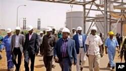 Members of a high level government delegation from Juba visit oil fields of Paloich, South Sudan, Feb. 21, 2012.