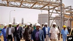 Members of a high level government delegation from Juba visit oil fields of Paloich, South Sudan, Feb. 21, 2012.