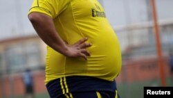 FILE - A player is pictured during his "Futbol de Peso" (Soccer of Weight ) league soccer match, a league for obese men who want to improve their health through soccer and nutritional counseling, in San Nicolas de los Garza, Mexico