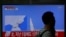 A man walks past a TV broadcasting a news report on North Korea's failed missile launch from its east coast, at a railway station in Seoul, South Korea, April 16, 2017. 