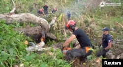 Rescue members from the French "Securite Civile" work on site in the aftermath of Cyclone Chido, in Mayotte, France, in this still image taken from a video released on Dec. 17, 2024. (Securite Civile/Handout via Reuters)