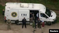 An aerial view shows a Federal Bureau of Investigation (FBI) van where a search is being conducted for Francisco Oropeza, 38, who police say shot dead five neighbors in Cleveland, Texas, U.S. April 29, 2023 in a still image from video. ABC affiliate KTRK via REUTERS