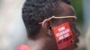 FILE - A Ugandan man is seen during LGBT Pride celebrations in Entebbe, Uganda, Aug. 9, 2014. Nineteen members of the country's LGBT community were arrested last month for gathering in public in violation of a coronavirus lockdown.