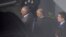 FILE - In this photo shot through a fence, former Brazilian President Michel Temer, left, is seen at the international airport in Sao Paulo, Brazil, March 21, 2019.