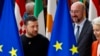 Ukraine's President Volodymyr Zelenskyy, left, European Commission President Ursula von der Leyen, right, and European Council President Charles Michel arrive for a group photo during an EU summit in Brussels, Oct. 17, 2024. 