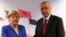 FILE - Turkish President Tayyip Erdogan meets with Germany's Chancellor Angela Merkel in Brussels, Belgium, July 11, 2018. 