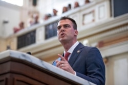 FILE - Oklahoma Gov. Kevin Stitt in Oklahoma City, February 3, 2020. Stitt said hydroxychloroquine was showing some promise in early March, and he didn't want Oklahoma to miss out.