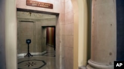 An empty hallway is seen at the entrance to Speaker of the House John Boehner's office suite in the U.S. Capitol Sunday morning, September 29, 2013, as a government shutdown looms, in Washington. 