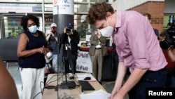 Priscilla Bennett, the first person in Philadelphia to cast an early ballot for the 2020 President Election, is seen at a voting satellite location on Temple University's campus in Philadelphia, Pennsylvania.