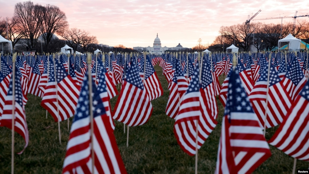 Thousands of U.S. flags are seen at the National Mall, to represent the people who are unable to travel to Washington for the inauguration, Jan. 18, 2021.