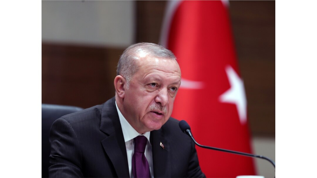 FILE - Turkish President Recep Tayyip Erdogan speaks during a news conference ahead of a visit to Algeria, at Ataturk airport in Istanbul, Turkey, January 26, 2020.