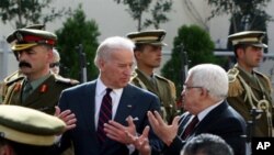 Palestinian president Mahmud Abbas (R) welcomes US Vice President Joe Biden (L) prior to their meeting in the West Bank city of Ramallah, 10 Mar 2010