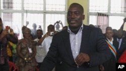 Congolese president Joseph Kabila casts his ballot in the country's presidential election at a polling station in Kinshasa, Democratic Republic of Congo, Monday Nov. 28, 2011