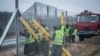 Prison inmates build a second protective fence on the border between Hungary and Serbia, near Kelebia, 178 kilometers southeast of Budapest, Hungary, March 1, 2017.