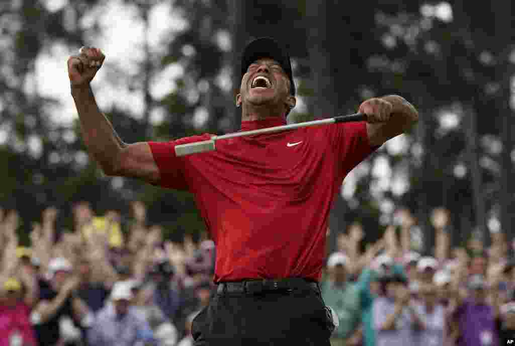 Tiger Woods reacts as he wins the Masters golf tournament, April 14, 2019, in Augusta, Georgia, USA.