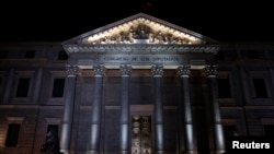 FILE - The Spanish Parliament building is seen at night in central Madrid, Spain, March 2, 2016. 