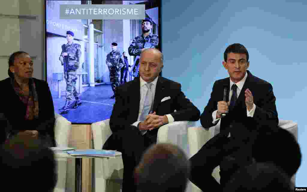 French Prime Minister Manuel Valls, right, Foreign Affairs Minister Laurent Fabius, center, and Justice minister Christiane Taubira attend a news conference to unveil new security measures ahead of a defense council at the Elysee Palace in Paris, Jan. 21, 2015.