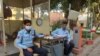 Security guards wear masks hoping it will save them from the coronavirus as the number of recorded infections in India spikes in the last week to 73. (Anjana Pasricha/VOA)