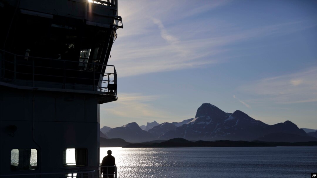 FILE - Personnel stand aboard the Finnish icebreaker MSV Nordica as it arrives into Nuuk, Greenland, after traversing the Northwest Passage through the Canadian Arctic Archipelago, July 29, 2017.