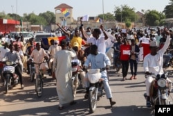 Protesters march during an anti-France demonstration in N'djamena, Chad, on Dec. 6, 2024.